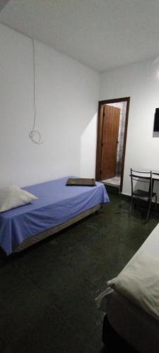 Katil atau katil-katil dalam bilik di Hotel Chalé Centro