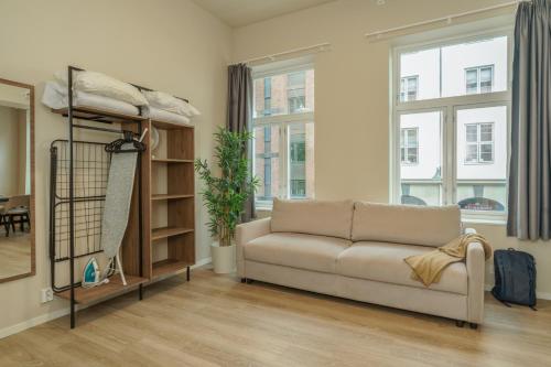 a living room with a couch and a bunk bed at MAYA Apartments - Parkveien in Oslo