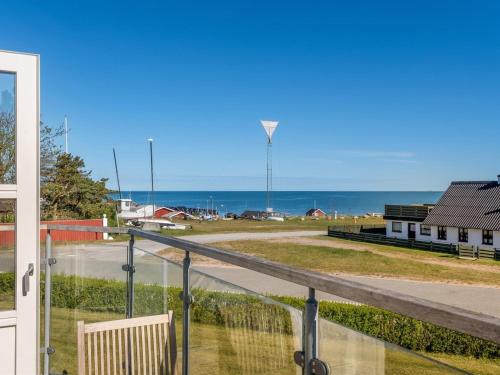a view of the ocean from the balcony of a house at Holiday Home Tara - 300m from the sea by Interhome in Læsø