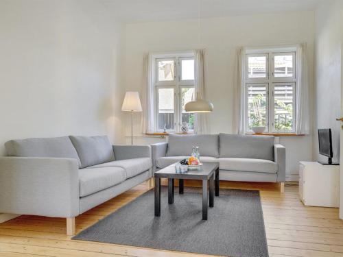 a living room with a couch and a table at Apartment Ejler - 200m from the sea by Interhome in Skagen