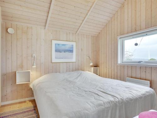 Una cama o camas en una habitación de Holiday Home Bosilka - 75m from the sea by Interhome