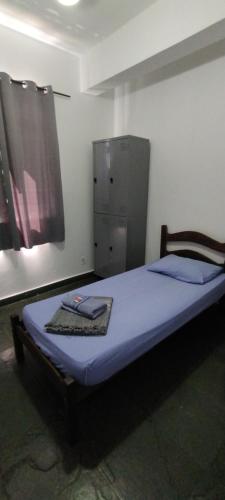 Katil atau katil-katil dalam bilik di Hotel Chalé Centro