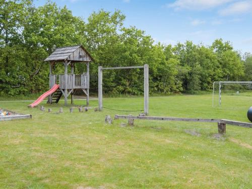 a park with a playground with a play equipment at Holiday Home Hailka by Interhome in Give