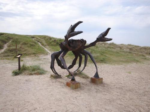 a metal statue of a crab on a dirt road at Holiday Home Fredsine - 900m from the sea by Interhome in Fjerritslev