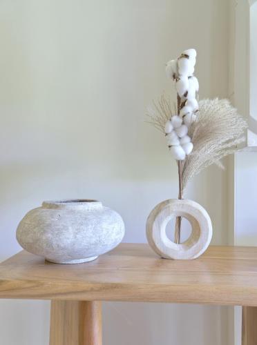 two vases sitting on top of a wooden table at Cocooning and spa in Varages