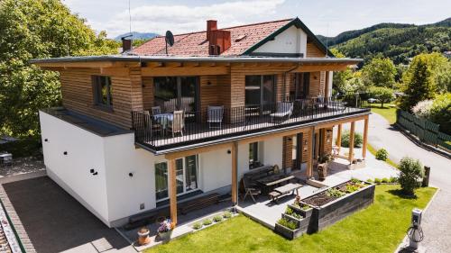 an aerial view of a house with a deck at Seespitz 37 - Ferienwohnungen Eisendle in Seeboden