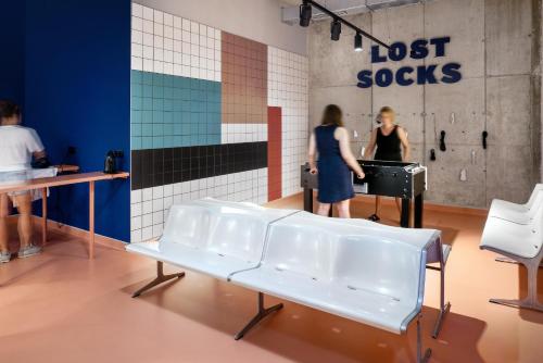 two women playing a piano in a room at The Social Hub Vienna in Vienna