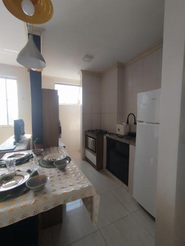 a kitchen with a table with bowls on it at Nosso lar in Belém