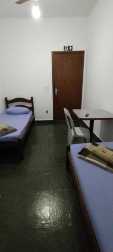 Katil atau katil-katil dalam bilik di Hotel Chalé Centro