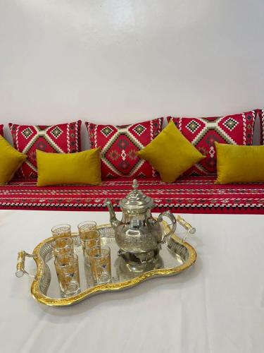 a tray of glasses on a tray with a tea pot at Dar Chefchauen in Chefchaouene