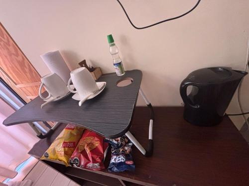 a table with a bag of chips on a table at Hostal California in El Cerrillo