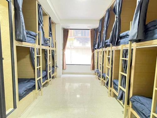 a row of bunk beds in a dorm room at Nhật's Sapa Central Hostel in Sa Pa