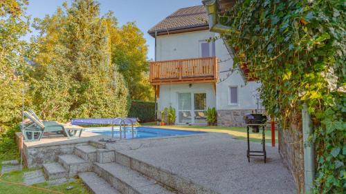 a house with a swimming pool in the yard at Vila Familia in Turčianske Teplice