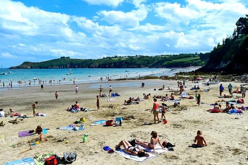 a large group of people on a beach at Gîte De Kerberso in Pléhédel