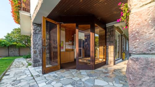 an entrance to a building with glass doors at Vila Familia in Turčianske Teplice