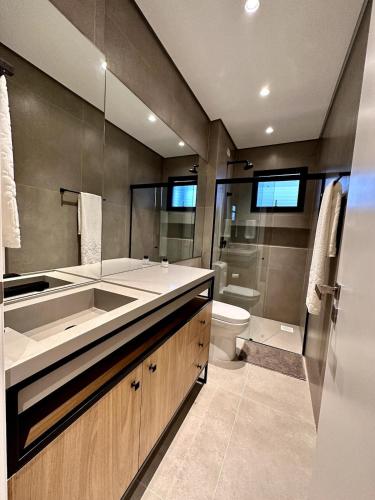 a bathroom with a sink and a toilet at Brava Paradise in Cabeçudas