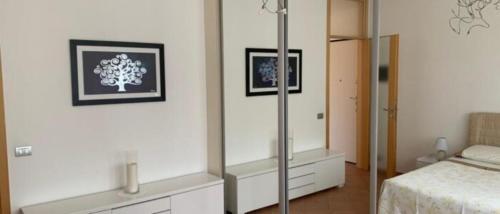a bedroom with a bed and a mirror at Casa Vacanza al Capriano in Cantello