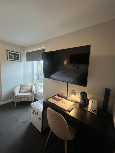TV o dispositivi per l'intrattenimento presso Shore Street Apartments