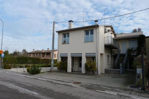 a white house on the side of a street at Alloggio turistico a Ravenna in Ravenna