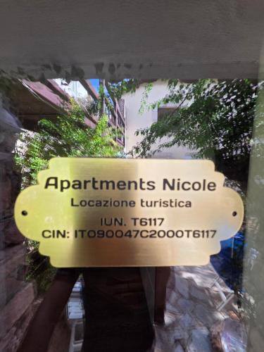 a sign for the entrance to ahibements nucleotideotechnology institute at Apartments Nicole in Porto Rotondo