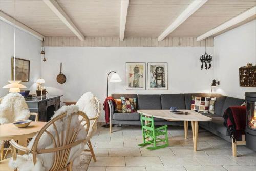 a living room with a couch and a table at 10439-Ulfborg-Gaffelbjergvej-60 in Øhuse