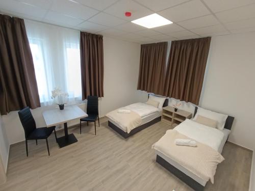Ένα ή περισσότερα κρεβάτια σε δωμάτιο στο Szatmári Apartman