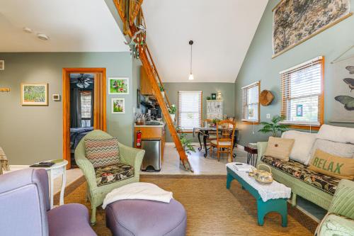 a living room with a couch and a table at Unique and Artistic Retreat Near Rehoboth Beach! in The Plantations