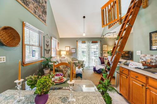 a kitchen with a ladder and a living room at Unique and Artistic Retreat Near Rehoboth Beach! in The Plantations