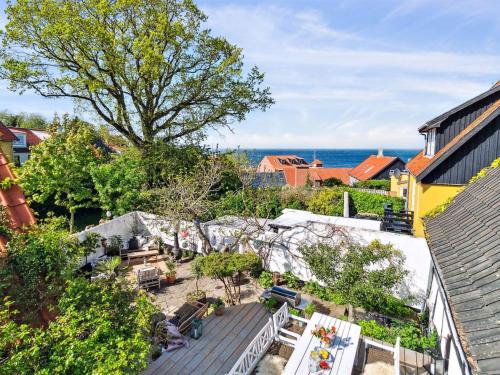 an aerial view of a backyard with a view of the ocean at Holiday Home Frederikke - 300m from the sea by Interhome in Gudhjem