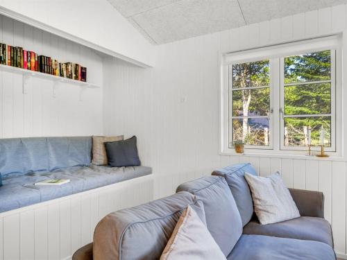 a living room with a couch and a window at Holiday Home Gedda - from the sea by Interhome in Hals
