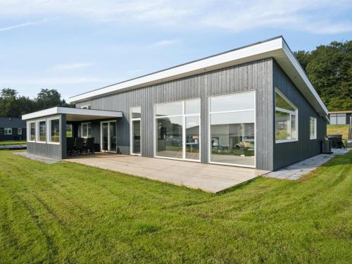 a modern house with a large yard at Holiday Home Alka - 500m from the sea by Interhome in Sjølund