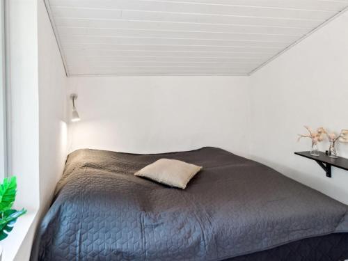 Ένα ή περισσότερα κρεβάτια σε δωμάτιο στο Holiday Home Hjalmine - 1-4km from the sea by Interhome