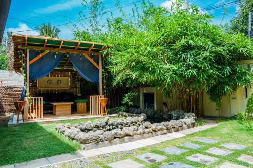 a house with a bunch of sheep in the yard at Abbi Holidays - Jaffna Luxurious Villa in Jaffna