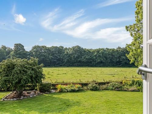 a view of a field from a window at Holiday Home Vinni - 25km from the sea by Interhome in Rødding