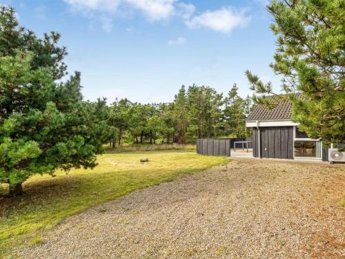 a home in the woods with a gravel yard at Holiday Home Skrollan - 200m to the fjord by Interhome in Sindrup