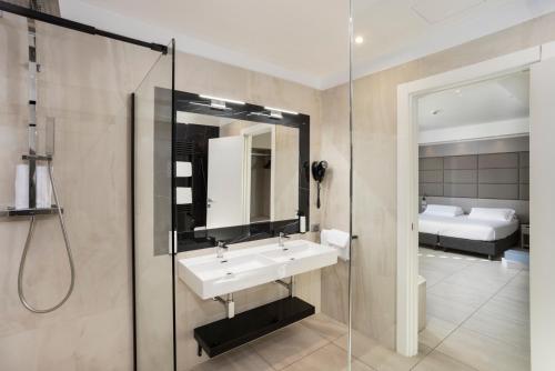 a bathroom with a sink and a shower at Eurogarden Hotel in Rome