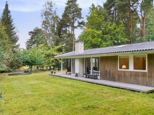 a house with a porch and a yard at Holiday Home Arto - 1-2km from the sea by Interhome in Vig