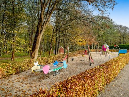 a park with a playground with swings at Apartment Kamp - 1km to the fjord by Interhome in Ringkøbing