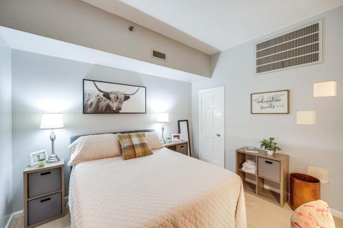 a bedroom with a bed and two night stands at Dtwn Cleveland Loft-Style Condo Walk to Stadiums! in Cleveland