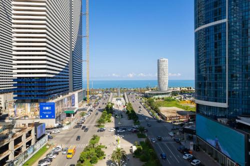 an aerial view of a city street with tall buildings at Batumi River Source in Batumi