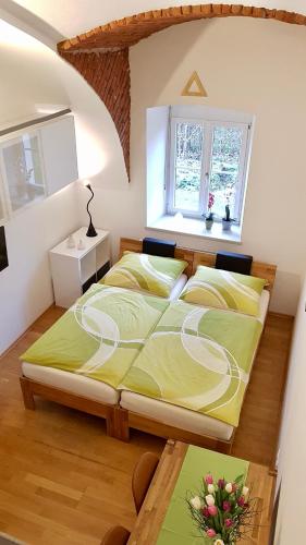 a bedroom with a large bed in a room at Haus Ferdinand in Fernitz