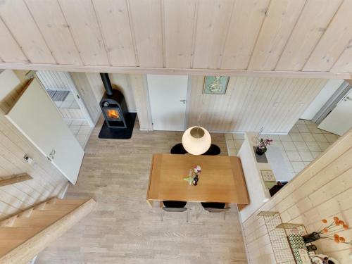 an overhead view of a living room with a wooden table at Holiday Home Wilmar - 380m from the sea by Interhome in Nabbe