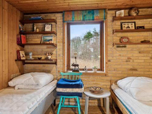 Katil atau katil-katil dalam bilik di Holiday Home Svanborg - 40m from the sea by Interhome
