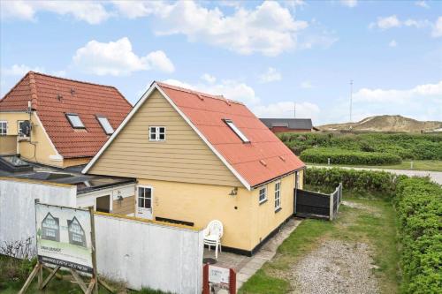 a yellow house with a red roof at 70282-Ulfborg-Kirkevej-2-A in Thorsminde