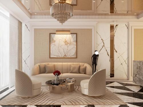 a living room with a couch and a table at Luxury Hotel Saigon in Ho Chi Minh City