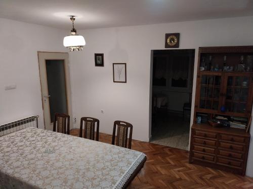 a room with a table and chairs and a dining room at Dve Breze 