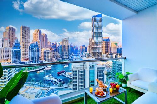 a room with a view of a city skyline at Barsana - Seaside Luxury 2BDR - Panoramic Marina & Sea Views in Dubai