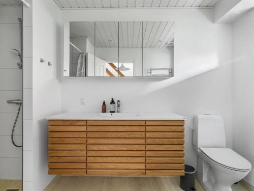 a bathroom with a sink and a toilet at Holiday Home Gravers - 150m from the sea by Interhome in Svendborg