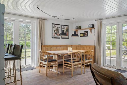 a dining room with a table and chairs at 10032-Ulfborg-Gaffelbjergvej-25 in Øhuse