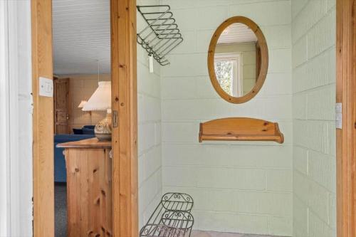 a hallway with a mirror on a wall at 10197-Ulfborg-Baekbyvej-69 in Øby